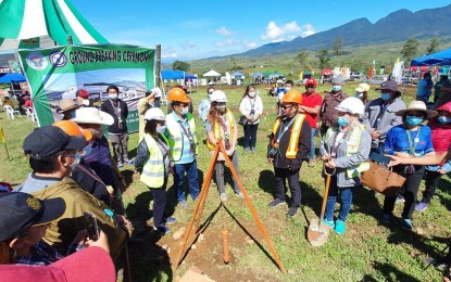 <p><strong>FOOD TERMINAL.</strong> With Northern Mindanao's tallest peak, Mount Kitanglad, in the background, officials of the Department of Agriculture and Mindanao Development Authority lead the groundbreaking for the PHP14 million food terminal in the Bukidnon town of Talakag on Thursday (Dec 10, 2020). The facility in Brgy. Miarayon is designed to store harvested crops by farmers to avoid profit loss during seasonal changes.<em> (PNA photo by Nef Luczon)</em></p>