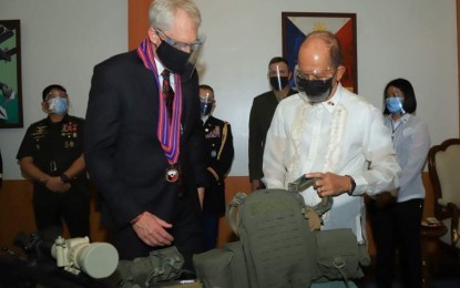 <p><strong>STRONG ALLIANCE.</strong> Acting US Defense Secretary Christopher Miller (left) and Department of National Defense Secretary Delfin Lorenzana (right) take a look at the PHP1.38 billion worth of military equipment donated by the US to the Philippines in Camp Aguinaldo, Quezon City on Dec. 8, 2020. The Armed Forces of the Philippines said these equipment will help boost its counter-terrorism capability and thanked the US government for the donation. <em>(Photo courtesy of DND Defense Communications Service)</em></p>