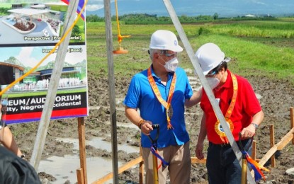 <p><strong>BREAKING GROUND</strong>. Senate Majority Leader Juan Miguel Zubiri (left) and Bacolod City Mayor Evelio Leonardia lead the groundbreaking rites for the PHP260-million museum-auditorium on a portion of the 8.8-hectare land donated by the Yanson family in Barangay Alijis on Saturday (Dec. 12, 2020). The construction of the project, which is funded by the national government, is expected to start in the first quarter of 2021.<em> (Photo courtesy of Julian Gatuslao)</em></p>