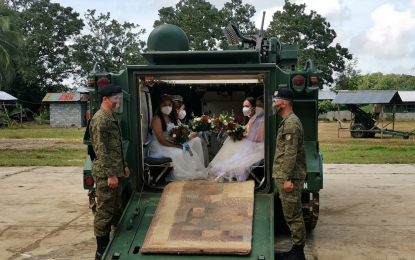 <p><strong>BRIDAL TANK</strong>. One of the armored personnel carriers of the Philippine Army's 4th Mechanized Infantry Battalion that was converted into a wedding vehicle. A wedding ceremony was held for six military personnel of 4Mech and their partners on Saturday (Dec. 12, 2020) at the soldiers' headquarters in Baloi, Lanao del Norte. <em>(Photo by Divina Suson)</em></p>