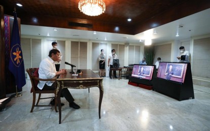 <p><strong>JAPANESE ENVOY.</strong> President Rodrigo Duterte watches as Ambassador-designate of Japan to the Philippines Koshikawa Kazuhiko, who is shown on-screen, presents his letter of credence to the President during the virtual presentation of credentials at the Malacañang Palace on Monday (Dec. 14, 2020). Duterte also received the credentials of Most Reverend Charles John Brown, the new Apostolic Nuncio-designate of the Holy See to the Philippines. <em>(Presidential photo by Karl Norman Alonzo)</em></p>