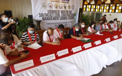 <p><strong>MARINE PROTECTION</strong>. Seven town mayors of the second district of Cebu on Tuesday (Dec. 15, 2020) signed a memorandum of agreement creating the Southeast Cebu Coastal Resource Management Council. The body aims to protect the marine resources of the province’s southeast towns.<em> (Photo courtesy of Cebu Provincial Capitol PIO)</em></p>