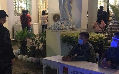 <p><strong>CHURCH WATCH</strong>. Personnel of Police Station 8 in Bacolod City man the assistance desk at the San Antonio Abad Parish Church during the start of the nine-day dawn masses on Wednesday (Dec. 16, 2020). The city's curfew hours have been modified to run from 11 p.m. to 3 a.m., from December 15 to 31, in consideration of the traditional dawn masses. <em>(Photo courtesy of Bacolod City Police Office, Police Station 8)</em></p>