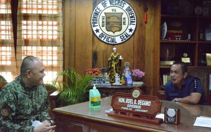 <p><strong>COURTESY CALL.</strong> PRO 7 (Central Visayas) regional director, Brig. Gen. Ronnie Montejo (left) makes a courtesy call on Negros Oriental Gov. Roel Degamo (right) at the Capitol on Wednesday (Dec. 16, 2020). The governor has asked the police director to investigate the spate of killings in the province. <em>(Photo courtesy of Capitol PIO)</em></p>