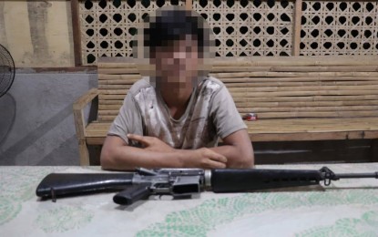 <p><strong>SURRENDER</strong>. The photo of Erwin Tigbawan alias Jordan, 18, and his firearm issued by the communist terrorist group when he surrendered to soldiers on Dec. 12, 2020 in Kananga, Leyte. The Philippine Army has welcomed the surrender of a young fighter of the New People’s Army (NPA) after repeated calls for him to return to his family. <em>(Photo courtesy of Philippine Army)</em></p>