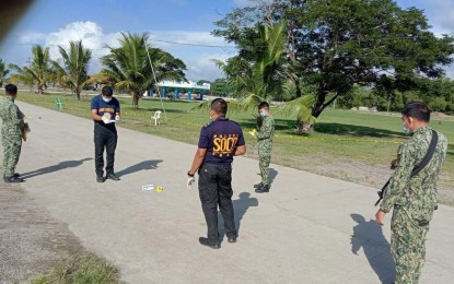 <p><strong>CRIME SCENE</strong>. Scene of the crime operatives of the Negros Occidental Police Crime Laboratory investigate the Reclamation Area of Pontevedra, Negros Occidental where Staff Sgt. Ildefonso Casugod, 37, the town police intelligence officer, was shot dead by unidentified motorcycle-riding assailants on Tuesday morning (Dec. 22, 2020). Capt. Hancel Lumandaz, town police officer-in-charge, said Casugod was hit on the head and declared dead at Bago City Hospital. <em>(Photo courtesy of Pontevedra Municipal Police Station)</em></p>