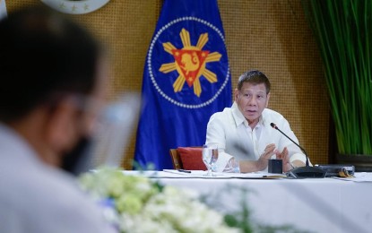 <p><strong>QUARANTINE CLASSIFICATION.</strong> President Rodrigo Duterte announces quarantine classifications in Metro Manila and other areas after meeting with Cabinet members and health officials and experts at the Heroes Hall in Malacañan Palace on Dec. 28, 2020. Aside from Metro Manila, Duterte said provinces of Batangas, Isabela, Lanao del Sur, Davao del Norte, and cities of Santiago, Iloilo, Tacloban, Iligan, and Davao will remain under general community quarantine from Jan. 1 to 31 next year. <em>(Presidential photo by King Rodriguez)</em></p>