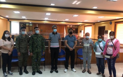 <p><strong>ASSISTANCE</strong>. Former rebels who recently surrendered to the authorities were given livelihood and financial assistance under the national government's Enhanced Comprehensive Local Integration Program (E-CLIP) during a simple ceremony held at the Sangguniang Panlalawigan session hall in Barangay Suklayin, Baler, Aurora on Tuesday (Dec. 29, 2020). Also in photo were Aurora Governor Gerardo Noveras (fourth from left), and DILG -Aurora provincial director Ofelio Tactac, Jr. (fourth from right). <em>(Photo by Jason de Asis)</em></p>