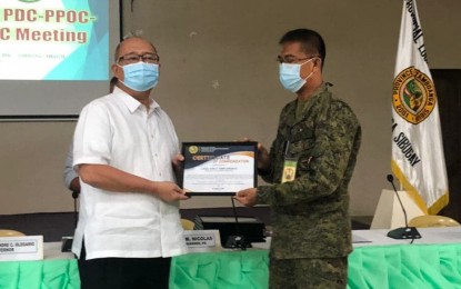 <p><strong>IGSOON BRIGADE</strong>. Zamboanga Sibugay Governor Wilter Yap Palma presents a certificate of commendation to Brig. Gen. Leonel Nicolas, commander of the Army's 102nd Infantry "Igsoon" Brigade, for its success in the anti-insurgency campaign in 2020. The success of the Igsoon Brigade in the anti-insurgency campaign leads to the declaration of Zamboanga Sibugay province as insurgency-free and development-ready province on Dec. 22, 2020. <em>(Photo courtesy of the Army's 102nd Infantry Brigade)</em></p>
