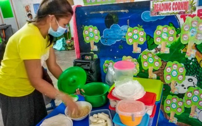 <p><strong>LIVELIHOOD.</strong> Jane Vaquilar cooks and sells street food at the evacuation center in Tuguegarao City. She earns livelihood for her family even amid floods and pandemic. <em>(Photo courtesy of Gerald Valdez, SK-Annafunan East president)</em></p>