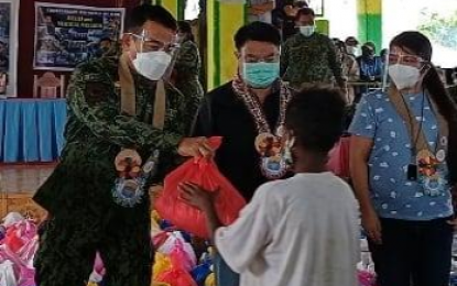 <p><strong>OUTREACH ACTIVITY.</strong> At least 850 Aetas and poor families received food and gift packs from Cagayan Valley police in Lasam, Cagayan on Jan. 2, 2021. PRO-2 director Brig. Gen. Crizaldo Nieves promised to extend more help to the “less fortunate” families especially in this time of pandemic. <em>(Photo courtesy of PRO-2)</em></p>