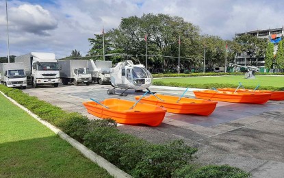 <p><strong>DONATION.</strong> The vehicles, rescue boats and a helicopter donated by business tycoon and MVP Group of Companies chairperson Manuel V. Pangilinan are displayed at the AFP General Headquarters on Thursday (Jan. 7, 2021). These were distributed to the various services of the AFP. <em>(Photo courtesy of AFP Public Affairs Office)</em></p>