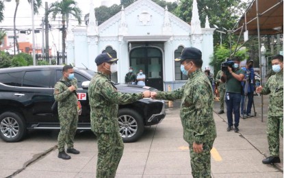 <p><strong>INSPECTION.</strong> NCRPO chief, Brig. Gen. Vicente Danao Jr. (left) and MPD director, Brig. Gen. Leo Francisco (right), do a fist bump during an inspection of one of the churches where Masses for the feast of the Black Nazarene would be held on Tuesday (Jan. 5, 2020). Over 27,000 police officers would be held to secure the annual religious feast on Jan. 9. <em>(Photo courtesy of NCRPO)</em></p>