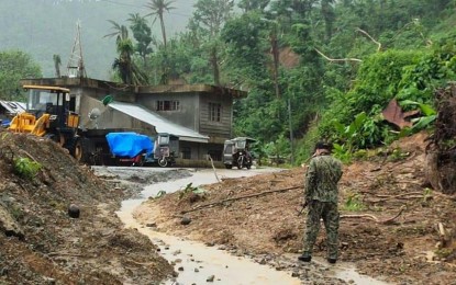 <p><strong>IMPASSABLE.</strong> Only motorcycles can pass through a road in Barangay Bagumbayan, Bato town, Catanduanes province after a landslide on Saturday (Jan. 9, 2021). Heavy rains since Friday night triggered floods and landslides in Catanduanes and Sorsogon. <em>(Photo courtesy of the Bato Municipal Police Station)</em></p>