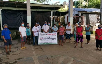 <p><strong>DENOUNCING TERROR</strong>. Officials and residents of Logero village in Marabut, Samar during its declaration of the Communist Party of the Philippines (CPP) and its armed wing, New People’s Army (NPA) as persona non-grata on Jan. 5, 2021. The Philippine Army on Saturday (Jan. 9, 2021) said the people condemned the rebel group's treacherous attacks and other human rights violations, including the ambush-slay of a cop on Dec 10, 2020.<em> (Photo courtesy of the Philippine Army)</em></p>