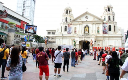 <p><strong>TRASLACION 2021.</strong> Devotees of the Black Nazarene observe physical distancing while attending Mass outside the Quiapo Church on Saturday (Jan. 9, 2021). The National Capital Region Police Office said the number of devotees in the area has reached 14,220 as of Saturday noon. <em>(PNA photo by Jess Escaros Jr.)</em></p>