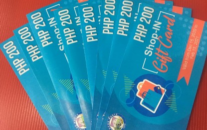 <p><strong>GIFT CARDS</strong>. The province of Ilocos Norte is using gift cards to benefit business owners and consumers who are both affected by the global novel coronavirus pandemic. Among the first batch of recipients given with gift cards amounting to PHP1,000 each are persons with disabilities. (<em>PNA photo by Leilanie G. Adriano</em>) </p>