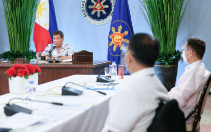 <p><strong>UK VARIANT</strong>. President Rodrigo Roa Duterte presides over a meeting with the Inter-Agency Task Force on the Emerging Infectious Diseases core members prior to his talk to the people at the Malago Clubhouse in Malacañang Park, Manila on Wednesday night (Jan. 13, 2021). Duterte is hoping that the UK variant would not be “more dangerous and more toxic” than the original variant. <em>(Presidential photo by Richard Madelo)</em></p>