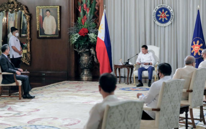 <p><strong>COURTESY CALL.</strong> President Rodrigo Roa Duterte discusses matters with People's Republic of China State Councilor and Foreign Minister Wang Yi, who paid a courtesy call on the President at the Malacañang Palace on Saturday (Jan. 16, 2021). Wang reciprocated Foreign Secretary Teodoro Locsin’s visit to China in October last year. <em>(Presidential photo by Richard Madelo)</em></p>