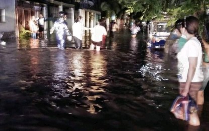 <p><strong>FLOODED.</strong> A flooded area in one of the affected villages in San Carlos City, Negros Occidental on Saturday night (Jan. 16, 2021). Heavy rains brought floods that left some 111 families still in evacuation centers on Sunday afternoon. <em>(Photo courtesy of San Carlos City, Negros Occidental)</em></p>