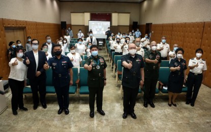 <p><strong>MENTAL HEALTH TRAINING.</strong> AFP chief-of-staff Gen. Gilbert Gapay joins the participants of the nine-day AFP Mental Health Training in a photo opportunity during the program's closing ceremony in Camp Aguinaldo on Thursday (Jan. 21, 2021). The 28 participants underwent seminar workshops on stress debriefing, trauma counseling, and psychological first aid during the nine-day activity.<em> (Photo courtesy of AFP Public Affairs Office)</em></p>