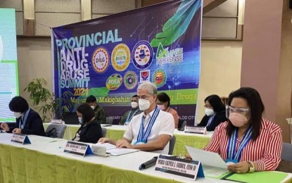 <p><strong>ANTI-DRUG CAMPAIGN.</strong> Negros Occidental Governor Eugenio Jose Lacson (2nd from right) and DILG 6 (Western Visayas) Assistant Director Maria Calpiza Sardua (right) join other officials during the Provincial Anti-Drug Abuse Summit 2021 held at the Negros Residences in Bacolod City on Friday (Jan. 22, 2021). With only 36.94 percent of the 601 barangays in the province cleared of drugs, Lacson said he is aiming to increase the figure to 70 percent. <em>(Photo courtesy of DILG-6)</em></p>