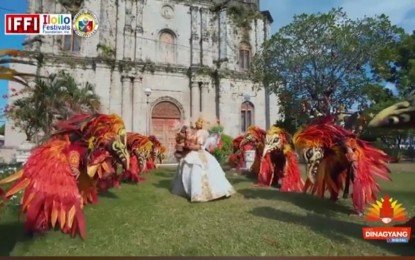 <p><strong>SUCCESSFUL DINAGYANG</strong>. Tribu Molo in a pre-filmed video performs in front of the St. Anne Parish church in Molo, one of the oldest churches in the Philippines. Tribu Molo was one of the seven tribes that performed in the Digital Dinagyang Festival 2021 of Iloilo City on Sunday (Jan. 24, 2021).<em> (PNA photo grab from Digital Dinagyang Festival 2021)</em></p>