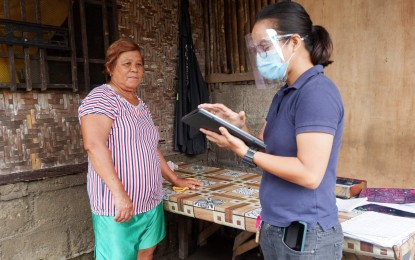 <p><strong>PRE-REGISTRATION</strong>. An enumerator of the Philippine Statistics Authority in Central Visayas gathers demographic data of registrants for the Philippine Identification System in this undated photo. Enumerators go house-to-house and record data through digital tablets that are sent directly to a secured PhilSys database.<em> (Photo courtesy of PSA-7)</em></p>
