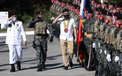 <p><strong>REMEMBERING SAF-44</strong>.  Department of Public Works and Highways (DPWH) Secretary Mark Villar (3rd from left), and Special Action Force (SAF) Director Police Major General Bernabe Balba  (left), salute SAF troopers during the arrival honors for the "Day of National Remembrance for the Gallant SAF 44" held in Camp Bagong Diwa, Bicutan in Taguig City on Monday  (Jan. 25, 2021). The event commemorates the heroism of the 44 members of the PNP's elite force who were killed on Jan. 25, 2015 in an operation aimed at hunting down Malaysian terrorist Zulkifli Abdhir, alias “Marwan”, in Mamasapano, Maguindanao. (<em>PNA photo by Joey Razon</em>) </p>
