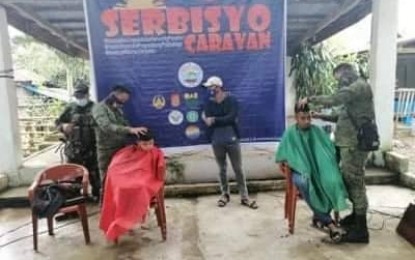 <p><strong>SERBISYO CARAVAN</strong>. Free haircut was among the services offered to residents in Barangay Ibona, Dingalan, Aurora during the conduct of Serbisyo Caravan on Monday (Jan. 25, 2021). Serbisyo Caravan is in line with President Rodrigo Duterte's Executive Order 70 institutionalizing the whole-of-nation approach to bring government services closer to the people. <em>(Photo courtesy of the Army's 91st IB)</em></p>