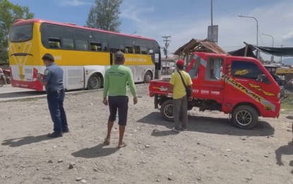 <p><strong>BLAST SITE.</strong> Police officers respond to a blast in the North Cotabato town of Tulunan around 12:30 p.m. Wednesday (Jan. 27, 2021). The explosion killed a sidewalk vendor and injured five other bystanders. <em>(Photos courtesy of former North Cotabato Board Member Socrates Piñol)</em></p>