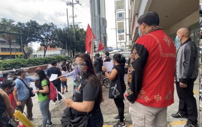<p><strong>MERE PROPAGANDA</strong>. Secretary Allen Capuyan, Chairperson of the National Commission on Indigenous Peoples (2<sup>nd</sup> from left, with back to the camera), watches protesters outside the NCIP building on Thursday morning while waiting for a chance to have a dialogue with them but failed. Capuyan said it was not the intention of the more or less 50 rallyists to talk with NCIP officials and even threw away copies of the Commission’s 2019 accomplishment report. (<em>Contributed photo</em>)</p>