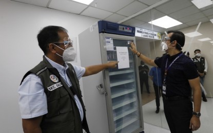 <p><strong>ENOUGH STORAGE FACILITIES.</strong> Manila Mayor Francisco 'Isko Moreno' Domagoso presents to vaccine czar Secretary Carlito Galvez on Friday (Jan. 29, 2021) the city's refrigeration systems for the Covid-19 vaccines located at the Sta. Ana Hospital. Domagoso assured that the city is one with the national government in achieving its goal to inoculate Filipinos with Covid-19 vaccines. <em>(PNA photo by Avito Dalan)</em></p>