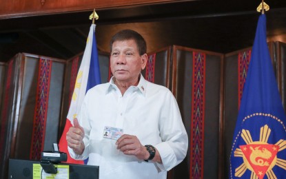 <p><strong>PRRD REGISTERS FOR NAT’L ID.</strong> President Rodrigo Duterte gives a thumbs up after checking one of the printed national identification cards following his submission in the registration process for the National Identification System administered by the Philippine Statistics Authority at the Malacañang Palace on January 21, 2021. <em>(Robinson Niñal/Presidential photo)</em></p>