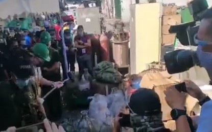 <p><strong>DESTROYED.</strong> PDEA chief Wilkins Villanueva (wearing PDEA hat) and Valenzuela Mayor Rex Gatchalian (2nd from left) lead the destruction of PHP904 million worth of illegal drugs in Valenzuela City on Thursday (Feb. 4, 2021). The destruction of the dangerous drugs is in compliance with the guidelines set on the custody and disposition of seized dangerous drugs pursuant to the Comprehensive Dangerous Drugs Act of 2002.<em> (Screengrab from PTV video)</em></p>