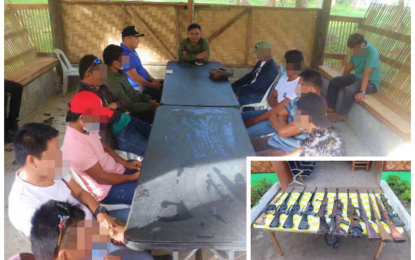 <p><strong>RIGHT DECISION</strong>. Lt. Col. Charlie Banaag, commander of the Army’s 6th Infantry Battalion, talks with the 11 former terrorists who opted to surrender to live normal lives in Maguindanao on Saturday (Feb. 6, 2021). The surrenderers (inset) also turned in 11 assorted high-powered firearms.<em> (Photo courtesy of 6IB)</em></p>