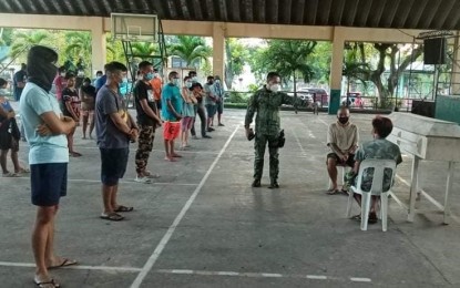 <p><strong>VIOLATORS</strong>. Some 39 residents of Silay City, Negros Occidental were apprehended and reminded to follow the Covid-19 health and safety protocols during a seminar held inside an auditorium on Feb. 4, 2021. In a statement on Monday (Feb. 8, 2021), city police chief, Maj. Rollie Pondevilla, said that instead of imposing a PHP1,000 fine on the violators, they were instead told to attend a seminar and given face masks before allowed to go home.<em> (Photo courtesy of Silay City Police Station PCR)</em></p>