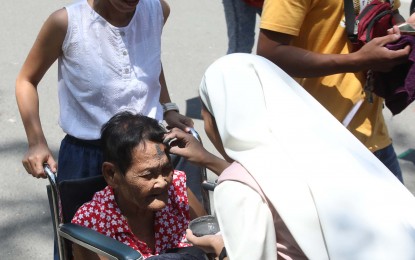 <p><strong>ASH WEDNESDAY OBSERVANCE</strong>. A nun places ash on the forehead of an older woman in the observance of Ash Wednesday at the Baclaran Church in Parañaque City last March 6, 2019. The Inter-Agency Task Force for the Management of Emerging Infectious Diseases has relaxed the restrictions on religious gatherings in areas placed under general community quarantine beginning Feb. 15, Malacañang announced. (<em>PNA photo by Avito C. Dalan</em>)</p>