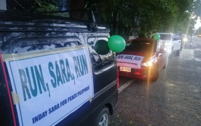 <p><strong>MOTORCADE</strong>. Vehicles line up as they prepare for the ‘Sara Para sa Bayan 2022’ motorcade on Sunday (Feb. 14, 2021) to prod Mayor Sara Z. Duterte to run for president in the 2022 national elections. Attended by the barangay leaders, deputy mayors, and businessmen, the motorcade traversed in the major thoroughfares of this city in time for Valentine’s Day. <em>(PNA photo by Che Palicte)</em></p>