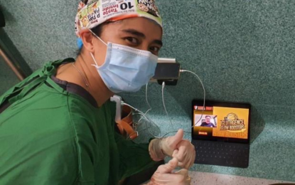 <p><strong>TOP PICK</strong>. Fille Claudine Cainglet poses with two thumbs up as she is watching the Women's National Basketball League (WNBL) Draft on Saturday (Feb. 13, 2021). Cainglet, a doctor, was doing a surgery at University of the East Ramon Magsaysay Memorial Medical Center UERM when Glutagence team named her WNBL Draft’s first overall pick. <em>(Contributed photo)</em></p>