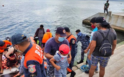 <p><strong>PREEMPTIVE EVACUATION</strong>. Personnel of the Philippine Coast Guard (PCG) in Batangas, as well as those from the local Philippine National Police, Bureau of Fire Protection, and the Municipal Disaster Risk Reduction and Management Office, conduct preemptive evacuation in the Taal Volcano Island on Tuesday (Feb. 16, 2021). The PCG said around 60 individuals have so far been evacuated after Phivolcs observed seismic activity and changes in Taal Volcano’s main crater lake.<em> (Photo courtesy of PCG)</em></p>
