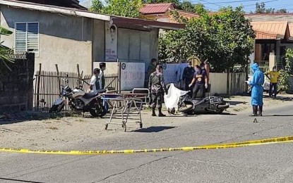 <p><strong>SHOOTING INCIDENT.</strong> Investigators are processing the scene of the crime following the shooting of the Public Order and Safety Office officer-in-charge in Calasiao town in Pangasinan on Tuesday (Feb.16, 2021). The victim was shot by still unidentified motorcycle-riding suspects. <em>(Photo courtesy of Jerick James Pasiliao)</em></p>
