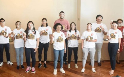 <p><strong>SOLID ROSTER.</strong> The players and the officials of the Glutagence Glow Boosters take a photo together with WNBL officials Rhose Montreal and Edward Aquino during the team's press launch on Thursday (Feb. 18, 2021). The expansion team was the big winner of the draft after picking Fille Claudine Cainglet, Camille Claro, and Khate Castillo with the first three picks of the proceeding. <em>(Photo courtesy of NBL)</em></p>