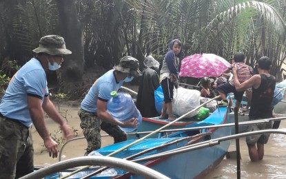 <p><strong>EVACUATION</strong>. The local government unit of Gigaquit in Surigao del Norte, with the support of the local police office, conducted a preemptive and forced evacuation of residents in the coastal area of Sitio Poctoy, Barangay Ipil on Saturday (Feb. 20, 2021) as Tropical Storm Auring approaches Caraga Region. <em>(Photo courtesy of Gigaquit MPS FB Account)</em></p>