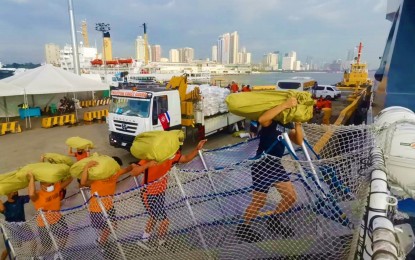 <p><strong>RELIEF FOR SURIGAO.</strong> Personnel of the Philippine Coast Guard (PCG) loads relief goods for the victims of Tropical Storm Auring in the provinces of Surigao del Norte and Surigao del Sur. Donations may be dropped at the PCG headquarters in Manila.<em> (Photo courtesy of PCG)</em></p>