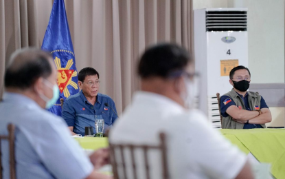 <p><strong>RETRIEVE THEM.</strong> President Rodrigo Roa Duterte convenes members of his Cabinet and local government officials of Surigao del Sur to assess the extent of the damage of Tropical Storm Auring, at the Villa Maria Luisa Hotel in Tandag City, Surigao del Sur on Feb. 23, 2021. Duterte in the situation briefing urged the military to retrieve children allegedly recruited by the New People’s Army to become child warriors. <em>(Presidential photo by King Rodriguez)</em></p>