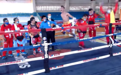 <p><strong>NEW CHAMP</strong>. Rene Mark Cuarto reacts after winning the International Boxing Federation mini-flyweight title in an all-Filipino clash at the Bula Gym in General Santos City on Saturday (Feb. 27, 2021). Cuarto defeated Pedro Taduran via unanimous decision. <em>(Screengrab from Powcast/MP promotions)</em></p>