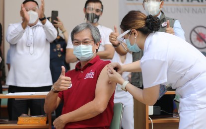 <p><strong>VACCINATION ROLLOUT.</strong> Philippine General Hospital Director Dr. Gerardo Legaspi flashes a thumbs-up sign while he gets vaccinated with CoronaVac during the vaccination rollout on March 1. Malacañang on Monday (March 8, 2021) said the vaccination of frontline healthcare workers is expected to be completed by May. <em>(PNA photo by Joey O. Razon)</em></p>