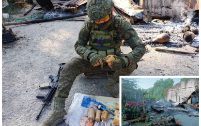 <p><strong>DISARMING IMPROVISED BOMBS.</strong> A military bomb expert deactivates improvised bombs recovered by government forces in Shariff Saydona Mustapha, Maguindanao, following a three-hour firefight Sunday (Feb. 28, 2021) that left four terrorists killed and three others wounded. The retreating terror group members also torched down a house (inset) as a diversionary tactic to cover their escape. <em>(Photo courtesy of 6ID)</em></p>