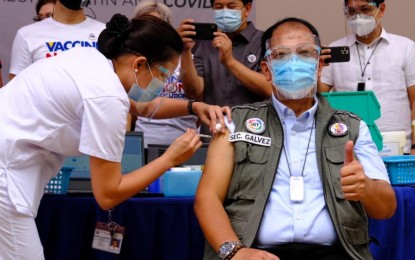 <p><strong>VACCINE ROLLOUT.</strong> National Task Force Against Covid-19 chief implementer and vaccine czar Secretary Carlito Galvez Jr. gets his first shot of CoronaVac at the Philippine General Hospital on Monday. He thanked the Chinese government for the “swift shipment” of the vaccines.<em> (PNA photo)</em></p>
